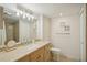 Updated bathroom with granite countertop and a shower at 851 Bayway Blvd # 104, Clearwater Beach, FL 33767
