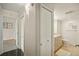Clean bathroom with light beige cabinets and tile floor at 851 Bayway Blvd # 104, Clearwater Beach, FL 33767