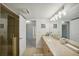 Bathroom with glass shower and updated vanity at 851 Bayway Blvd # 104, Clearwater Beach, FL 33767