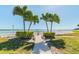 Pathway to private beach with lush tropical landscaping at 851 Bayway Blvd # 104, Clearwater Beach, FL 33767