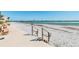 Relaxing beach view with benches and access to the sand at 851 Bayway Blvd # 104, Clearwater Beach, FL 33767