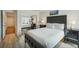 Bedroom with mirrored closet and hardwood floors at 851 Bayway Blvd # 104, Clearwater Beach, FL 33767