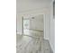 Mirrored closet with hardwood floors and balcony view at 851 Bayway Blvd # 104, Clearwater Beach, FL 33767