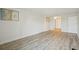 Spacious bedroom with wood-look floors and mirrored closet at 851 Bayway Blvd # 104, Clearwater Beach, FL 33767