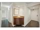 Bright entryway with built-in cabinet and wood-look flooring at 851 Bayway Blvd # 104, Clearwater Beach, FL 33767