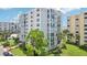 Building exterior showcasing the architectural design and landscaping at 851 Bayway Blvd # 104, Clearwater Beach, FL 33767