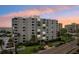 Luxury condo building at sunset, offering breathtaking views at 851 Bayway Blvd # 104, Clearwater Beach, FL 33767