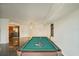 Game room with pool table, and kitchen in background at 851 Bayway Blvd # 104, Clearwater Beach, FL 33767