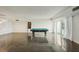 Spacious game room with pool table and hardwood floors at 851 Bayway Blvd # 104, Clearwater Beach, FL 33767