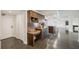Kitchen with granite countertop, wooden cabinets and built-in desk at 851 Bayway Blvd # 104, Clearwater Beach, FL 33767