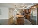 Updated kitchen featuring granite countertops and wood cabinets at 851 Bayway Blvd # 104, Clearwater Beach, FL 33767