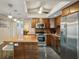 Bright kitchen, granite counters, stainless steel appliances, breakfast bar at 851 Bayway Blvd # 104, Clearwater Beach, FL 33767