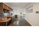 Kitchen with granite countertop, wooden cabinets and built-in desk at 851 Bayway Blvd # 104, Clearwater Beach, FL 33767
