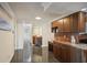 Kitchen with granite countertop and wooden cabinets at 851 Bayway Blvd # 104, Clearwater Beach, FL 33767