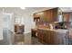 Kitchen with granite countertop and wooden cabinets at 851 Bayway Blvd # 104, Clearwater Beach, FL 33767