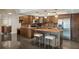 Modern kitchen with granite island and stainless steel appliances at 851 Bayway Blvd # 104, Clearwater Beach, FL 33767