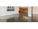 Modern kitchen and living area with shiny floors at 851 Bayway Blvd # 104, Clearwater Beach, FL 33767
