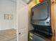 Stackable washer and dryer in a well-lit closet at 851 Bayway Blvd # 104, Clearwater Beach, FL 33767
