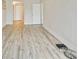 Bright living room featuring hardwood floors and access to a balcony at 851 Bayway Blvd # 104, Clearwater Beach, FL 33767