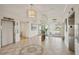 Spacious lobby with elevator access and modern light fixture at 851 Bayway Blvd # 104, Clearwater Beach, FL 33767