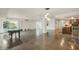 Open concept living space with pool table, kitchen and water views at 851 Bayway Blvd # 104, Clearwater Beach, FL 33767