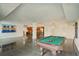 Open floorplan with pool table and kitchen at 851 Bayway Blvd # 104, Clearwater Beach, FL 33767