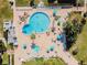 Resort-style pool with plenty of lounge chairs and umbrellas for sunbathing at 851 Bayway Blvd # 104, Clearwater Beach, FL 33767