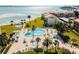 Resort-style pool and spa with beach access in background at 851 Bayway Blvd # 104, Clearwater Beach, FL 33767