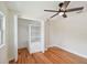 Spacious bedroom with hardwood floors and built-in shelving at 8320 Boxwood Dr, Tampa, FL 33615