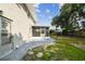 Back of house with screened porch and patio at 8320 Boxwood Dr, Tampa, FL 33615