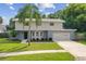 Two-story house with gray exterior and attached garage at 8320 Boxwood Dr, Tampa, FL 33615