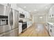 Modern kitchen with stainless steel appliances and white shaker cabinets at 8320 Boxwood Dr, Tampa, FL 33615