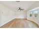 Bright living room with hardwood floors and large windows at 8320 Boxwood Dr, Tampa, FL 33615