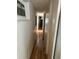 Long hallway with laminate wood flooring at 27466 Us Highway 19 N # 9, Clearwater, FL 33761