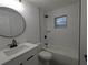 Modern bathroom with white marble and black fixtures at 14018 Barlington St, Spring Hill, FL 34609