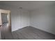 Spacious bedroom featuring double doors and grey flooring at 14018 Barlington St, Spring Hill, FL 34609