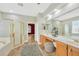 Bathroom with double vanity, a shower, and a bathtub at 806 Red Ash Ct, Seffner, FL 33584