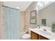 Bathroom with a shower/tub combo and wood vanity at 806 Red Ash Ct, Seffner, FL 33584