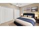 Guest bedroom with double doors and a navy bed at 806 Red Ash Ct, Seffner, FL 33584