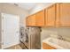 Laundry room with washer, dryer, and cabinets at 806 Red Ash Ct, Seffner, FL 33584