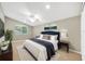 Main bedroom with a navy headboard and window seat at 806 Red Ash Ct, Seffner, FL 33584