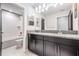 Modern bathroom with double vanity and subway tile at 905 Seagrape Dr, Ruskin, FL 33570