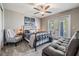 Cozy bedroom with french doors, neutral colors, and comfortable furnishings at 905 Seagrape Dr, Ruskin, FL 33570