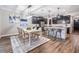 Bright dining area with white table and chairs, adjacent to kitchen at 905 Seagrape Dr, Ruskin, FL 33570