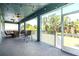 Screened-in patio with outdoor furniture and string lights, perfect for relaxing at 905 Seagrape Dr, Ruskin, FL 33570