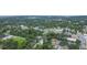 Expansive aerial view of a neighborhood with tree-lined streets and well-maintained homes at 14006 5Th St, Dade City, FL 33525