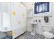 Bright bathroom featuring patterned tile floor, clawfoot tub, and an adorable ducky-themed shower curtain at 14006 5Th St, Dade City, FL 33525