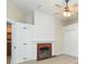 Bedroom featuring ceiling fan, brick fireplace, closet, and a painted white wall at 14006 5Th St, Dade City, FL 33525