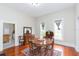 Elegant dining room with hardwood floors, natural light, and classic decor at 14006 5Th St, Dade City, FL 33525