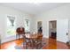 Cozy dining room with hardwood floors, natural light, and classic decor at 14006 5Th St, Dade City, FL 33525